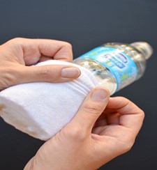 Image of sock bubble blower, sock pulled over a plastic water bottle.